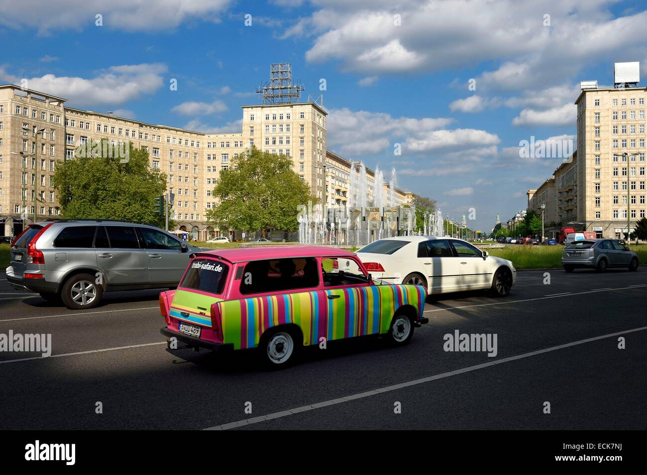 Germany, Berlin, Karl-Marx Allee is the largest artery of the country leading from Alexanderplatz to Frankfurter Tor and the communist regime annually paraded his army there, new look Trabant car Stock Photo