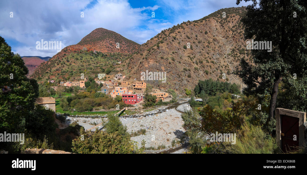 Horizontal panoramic (2 picture stitch) view of a Berber village in the Ourika Valley in the High Atlas Mountain range. Stock Photo