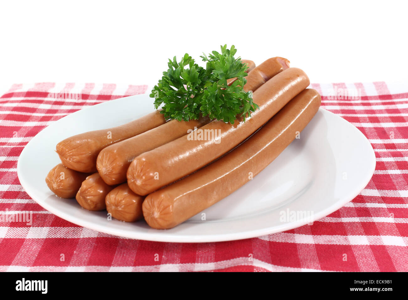 Wiener sausage with parsley on a plate Stock Photo - Alamy