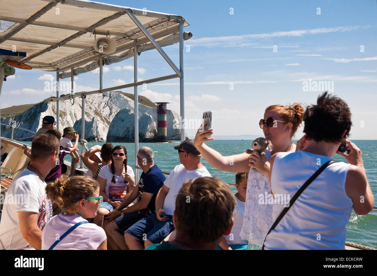 Horizontal view of tourists on a guided tour around the Needles in the Isle of Wight. Stock Photo