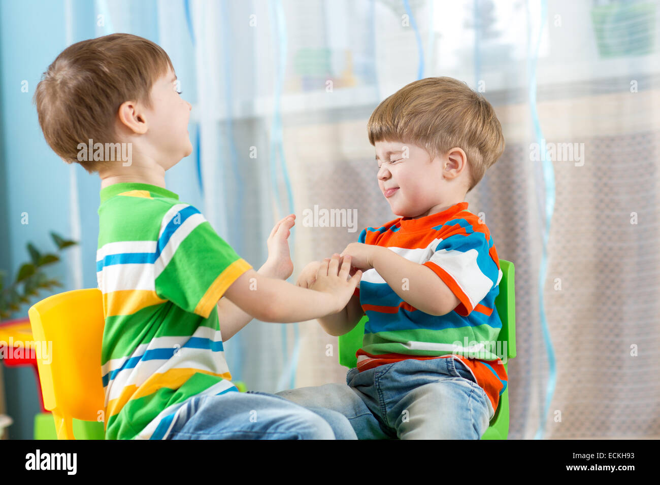 playful kids friends at home Stock Photo