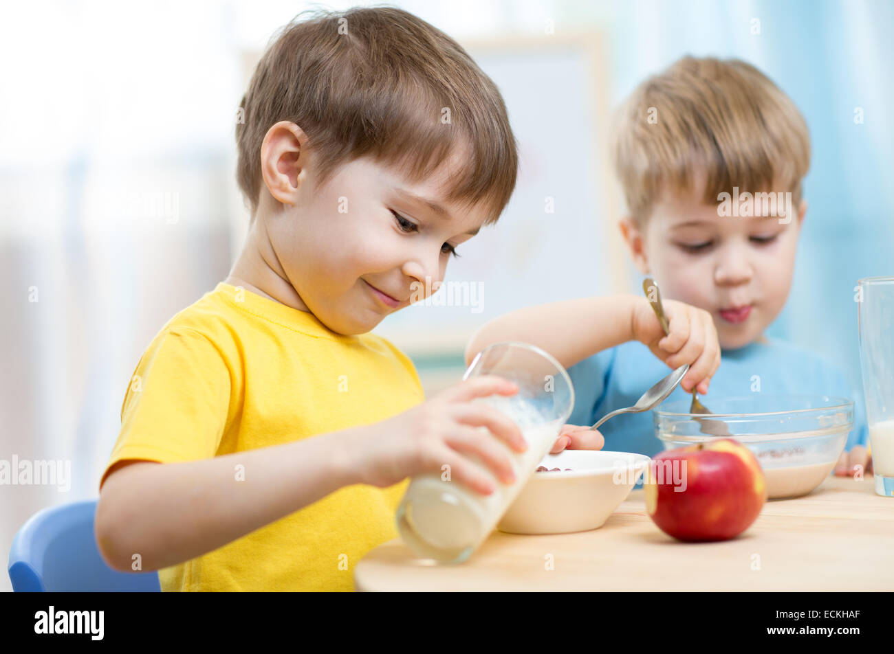 children eating healthy food at home Stock Photo