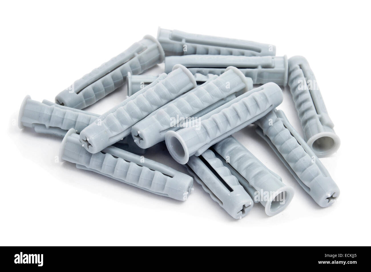 closeup of a pile of plastic wall plugs on a white background Stock Photo