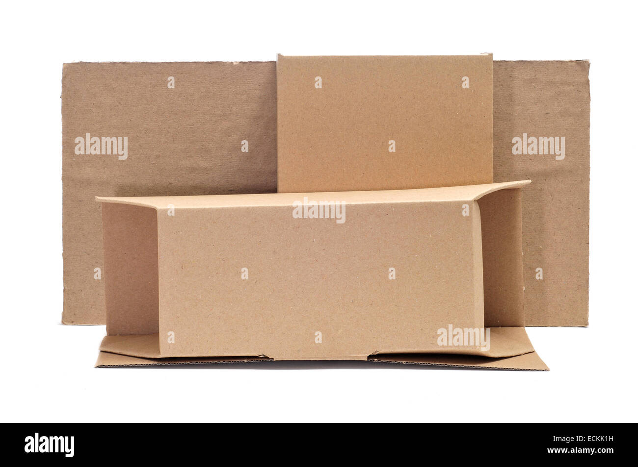 some brown cardboard boxes of different sizes and some pieces of