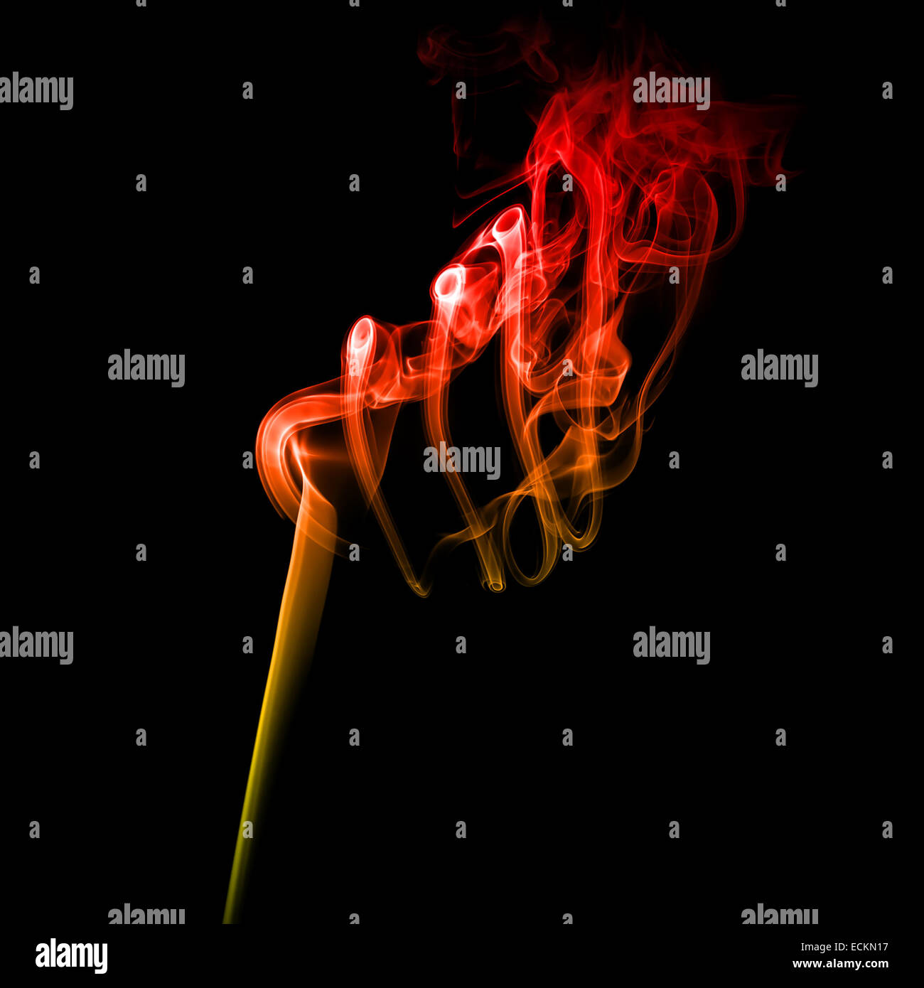 Abstract bright colored red smoke on a dark background. Stock Photo
