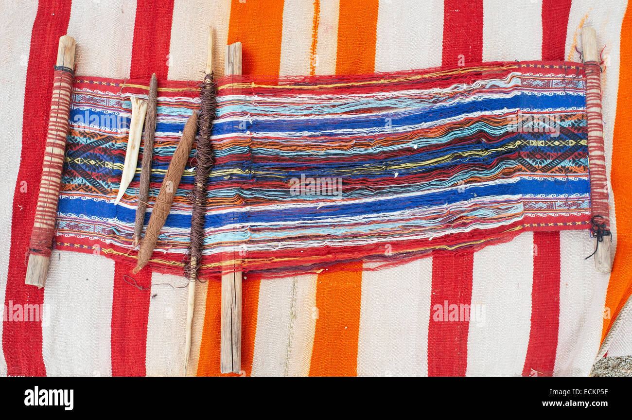 Indian loom in weaving process Stock Photo