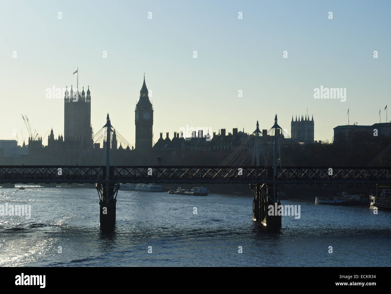 Semi-silhouette of Hungerford Bridge and Palace of Westminster, London, England, UK Stock Photo