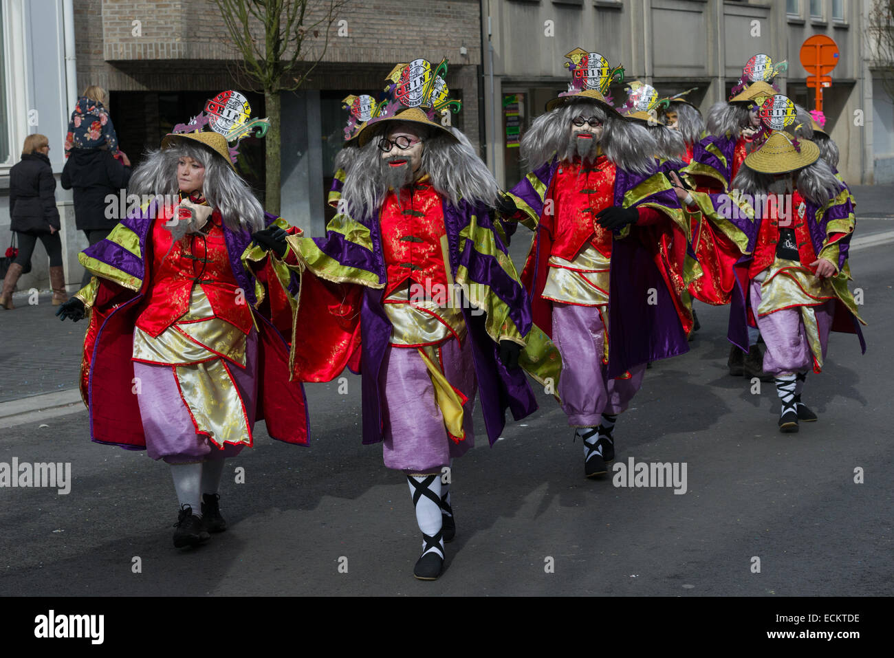 Carnival characters dressed up as racist Chinese stereotypes, in the traditionally offensive Aalst Carnival procession, Carnival Monday, Aalst, Belgium Stock Photo