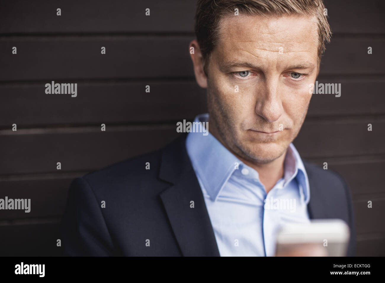 Businessman using smart phone Stock Photo