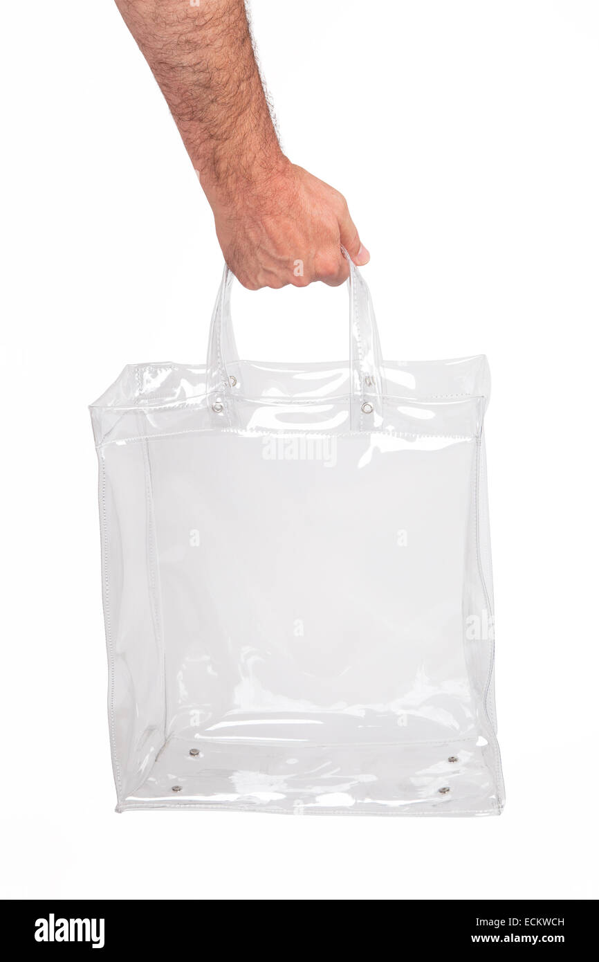 Human hand with transparent plastic bag, isolated on white. Stock Photo