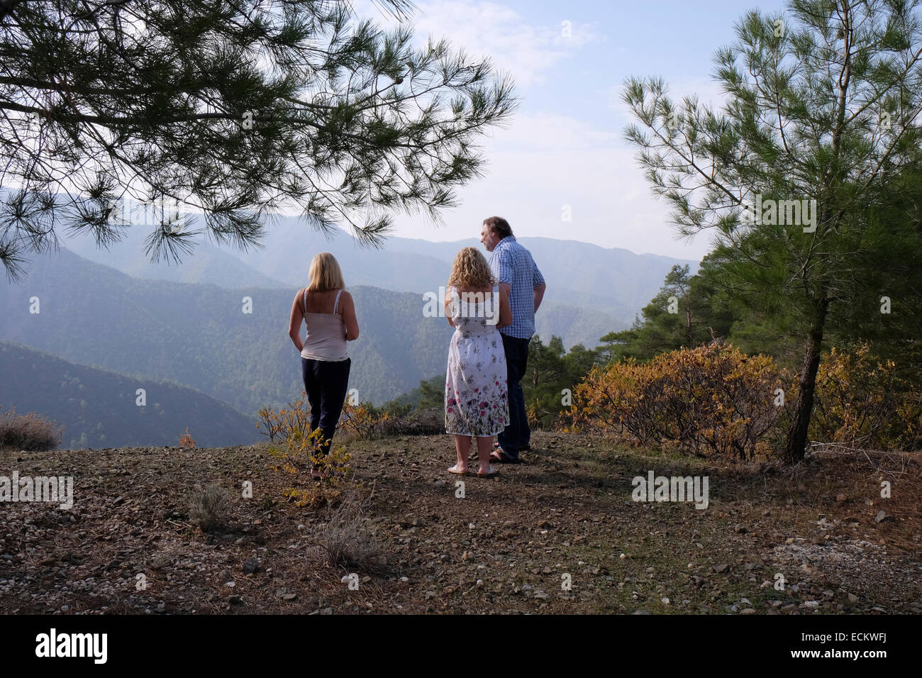 Three people admiring the scenery in the Troodos Mountains, Cedar Valley, Cyprus Stock Photo
