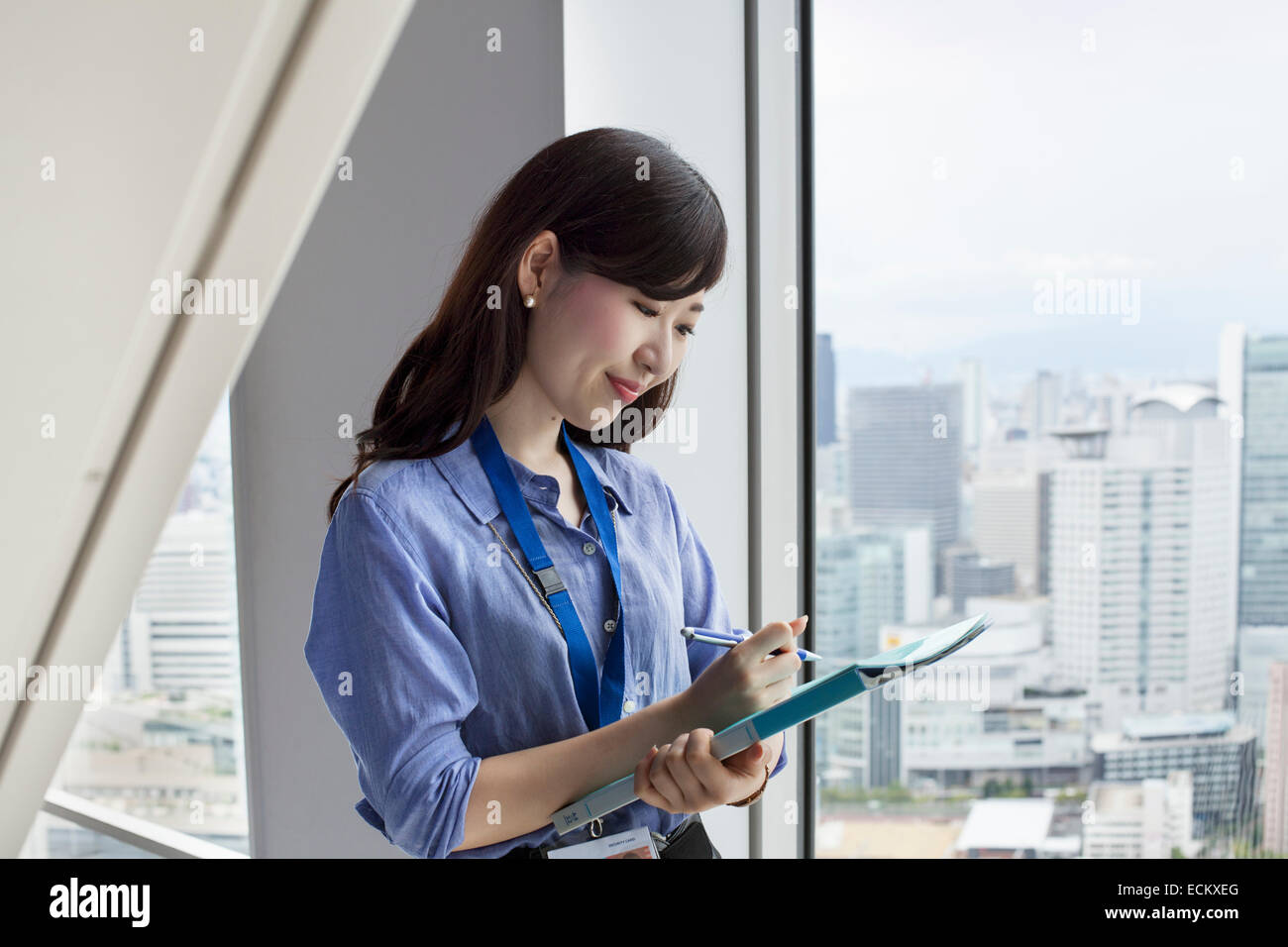 A working woman in an office building. Stock Photo