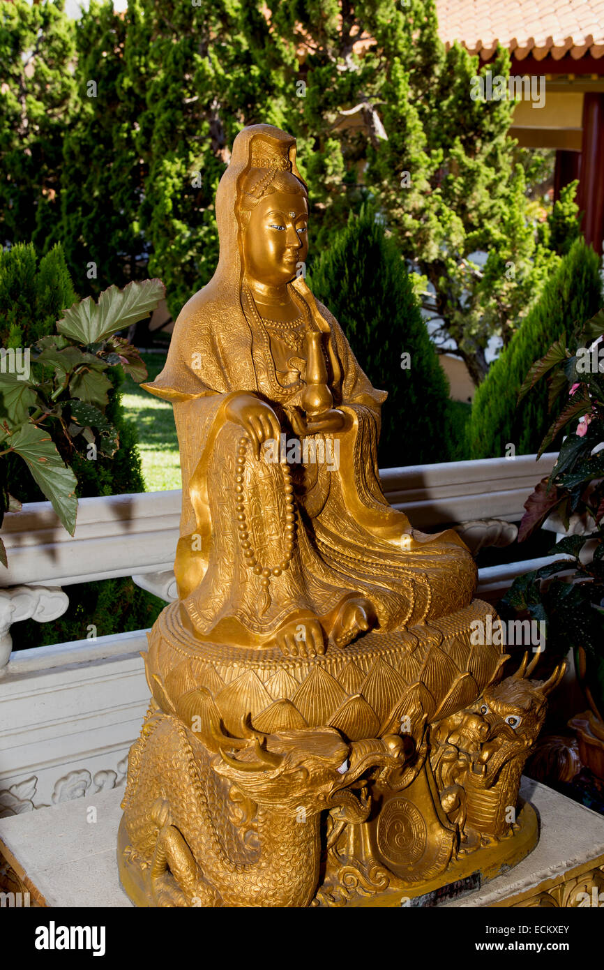 Statue of Avalokitesvara Bodhisattva, seated on lotus throne, atop two dragons, Buddhist temple, Hsi Lai Temple, Hacienda Heights, California Stock Photo