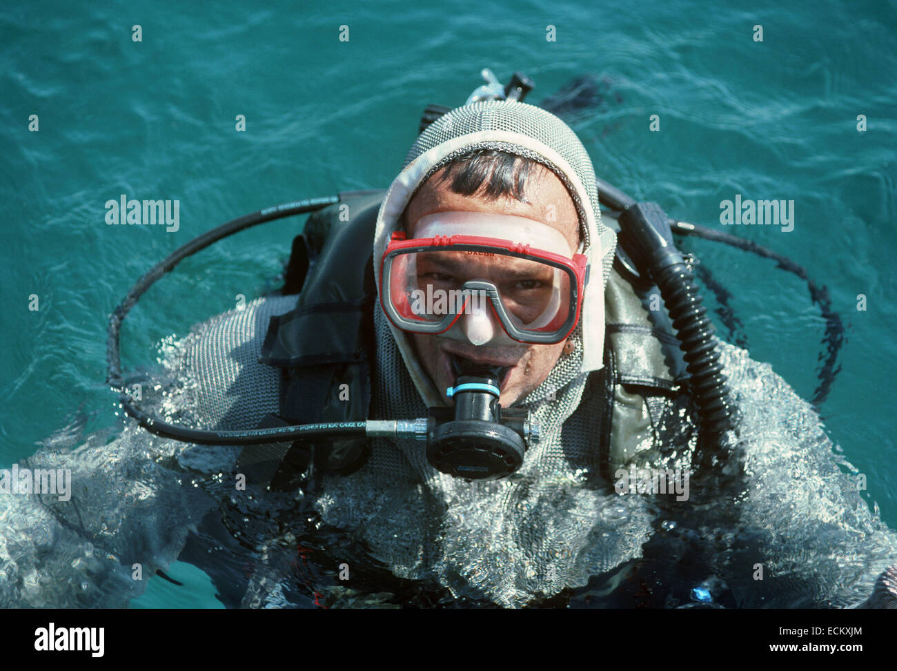 Underwater photographer dressed in chain mail protective suit