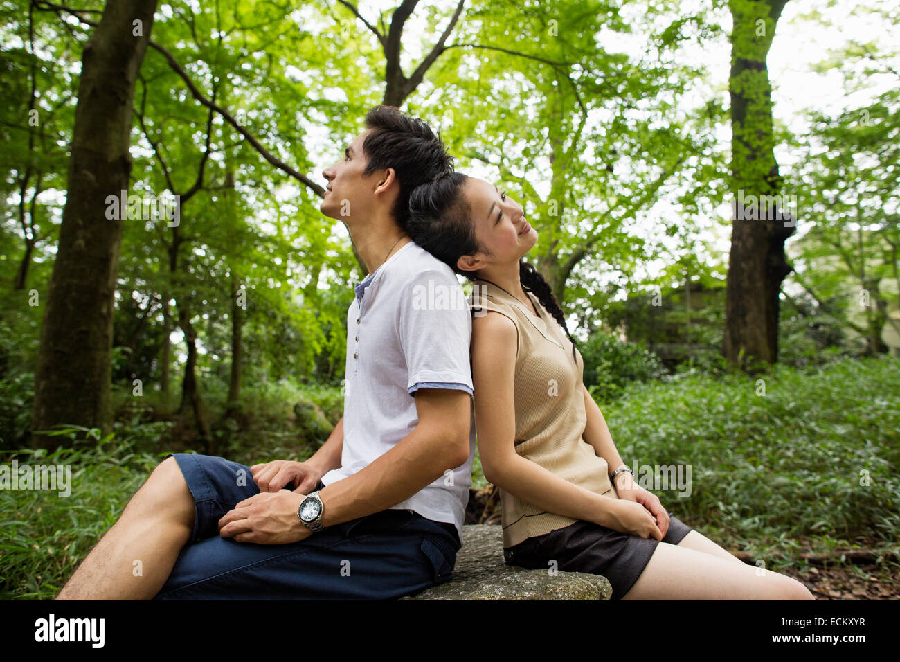 A couple at an outdoor party in a forest. Stock Photo