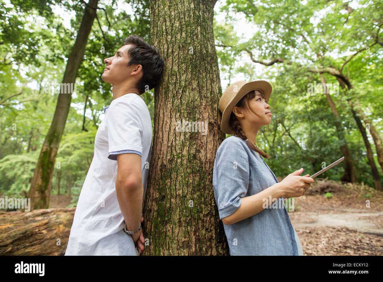 A couple at an outdoor party in a forest. Stock Photo