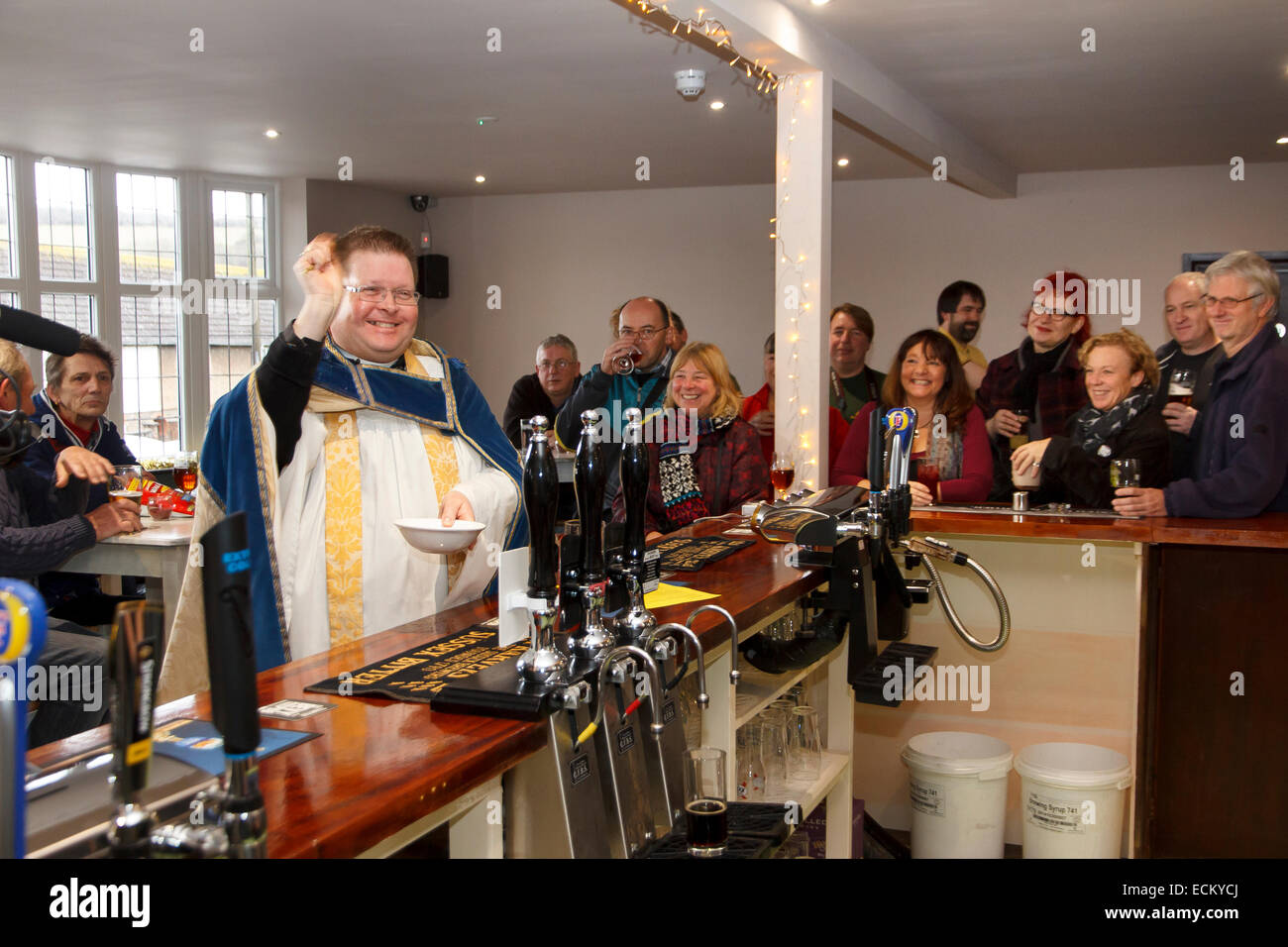 Brighton, UK - 12 December 2014: The opening of The Bevendean Cooperative Pub to the general public. In front of cameras from IT Stock Photo