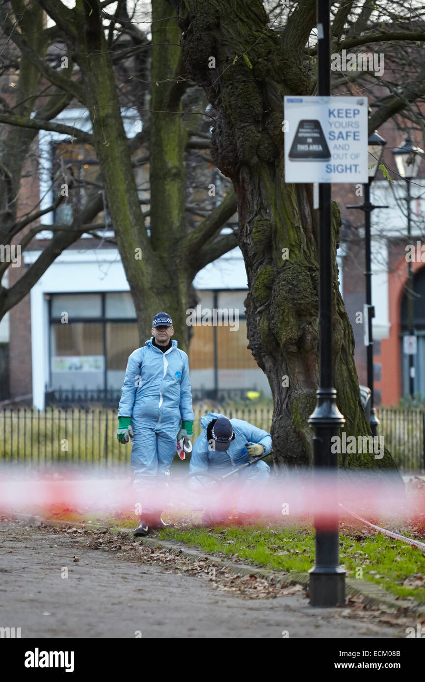 London, UK. 16th Dec, 2014. A man was shot in the leg last night (15th December 2014) at around 11:30pm near Highbury Fields park, following a disturbance at The Garage music venue. Crime scene investigators (in blue) are pictured today, searching the area with a metal detector. Police officers stood guard around the crime scene. The man's injuries are not thought to be life threatening. Islington. London. UK. December 16th, 2014. Credit:  Sam Barnes/Alamy Live News Stock Photo