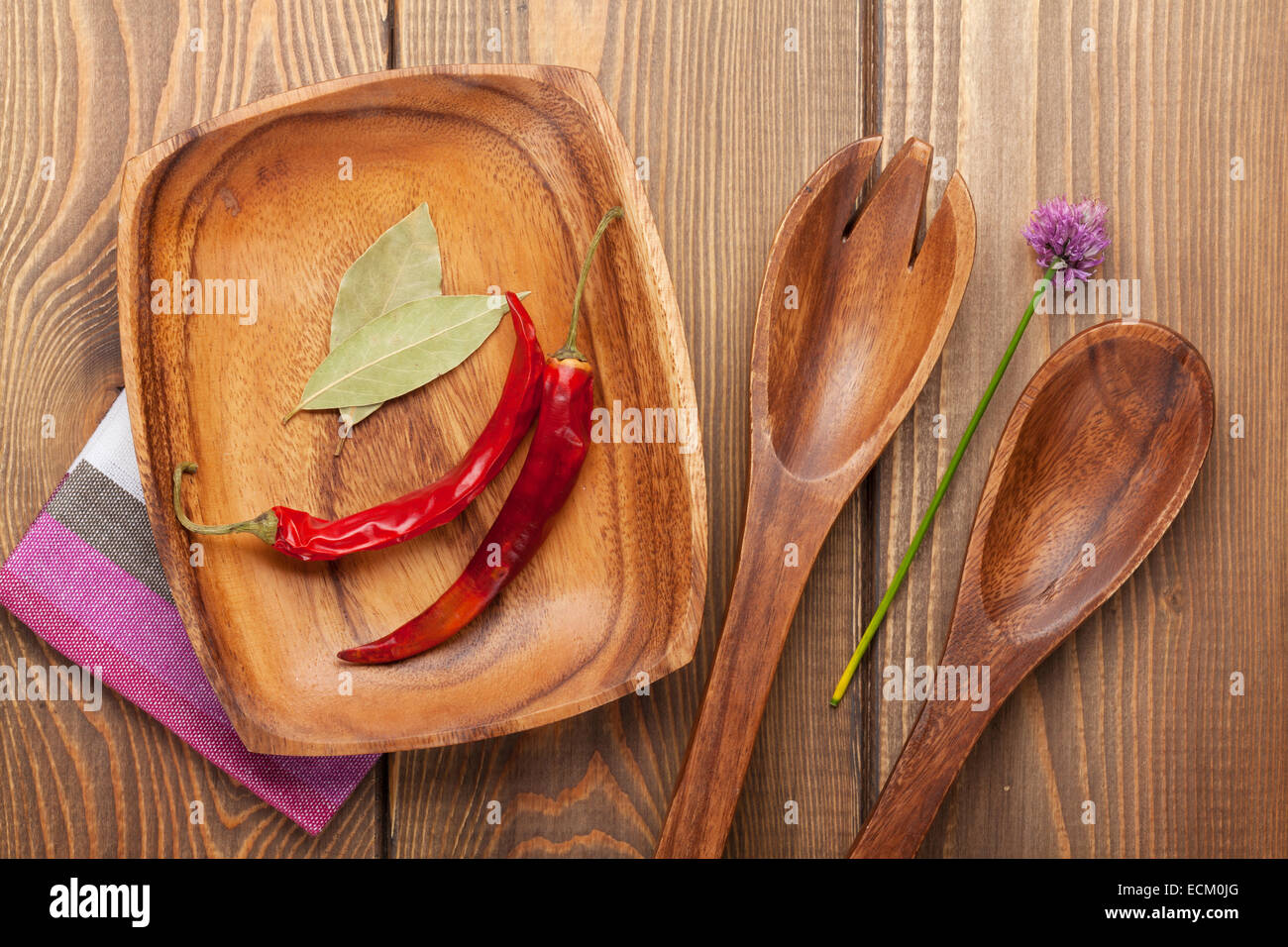 Spices and cooking utensils over wooden table Stock Photo