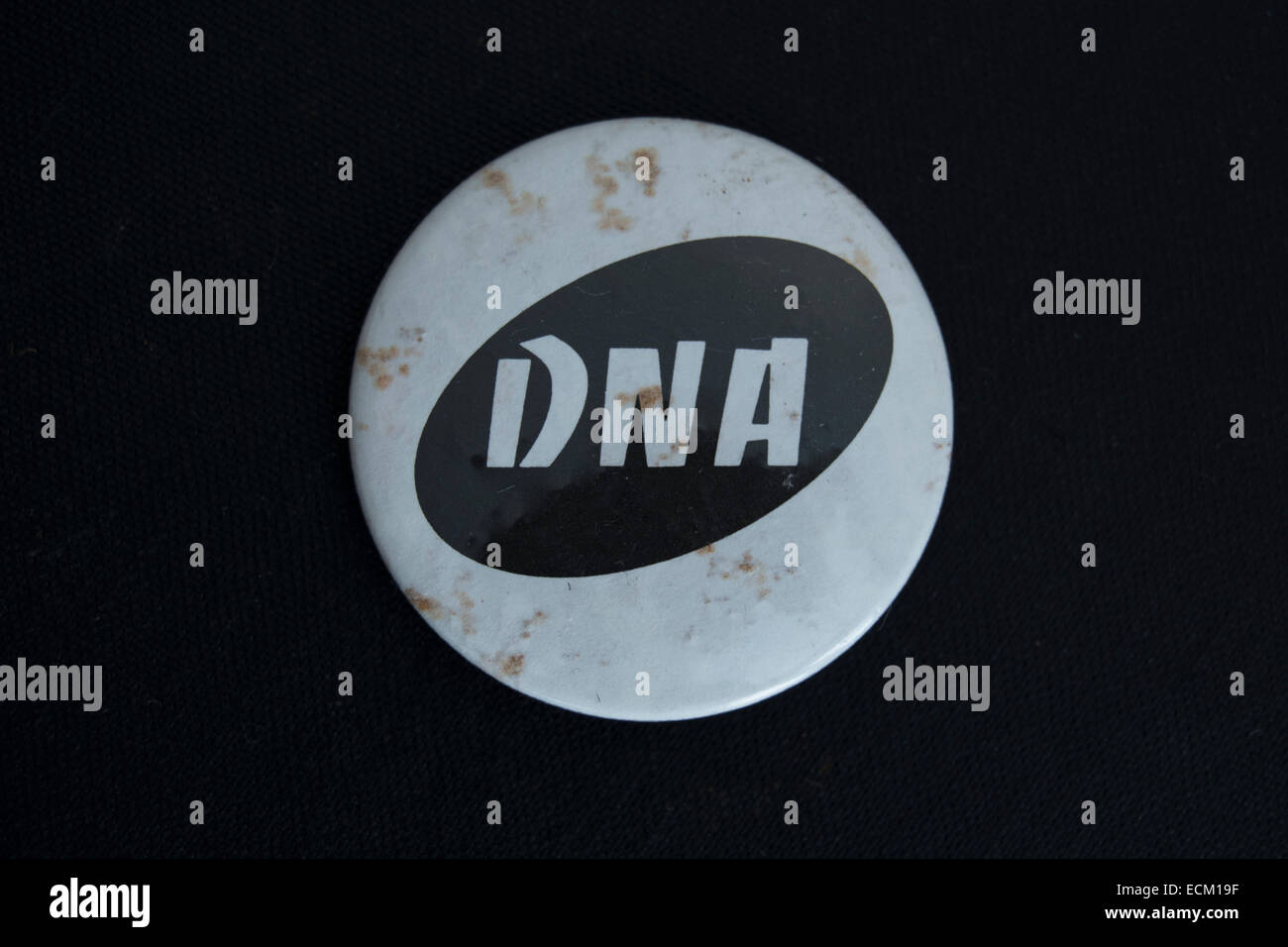 lapel badge promoting dna, a new york based no wave band of the 1980s ...