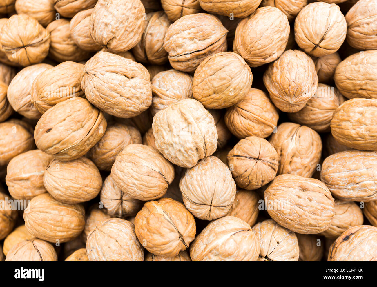 Many walnuts prepared for selling at a Turkish market street Stock