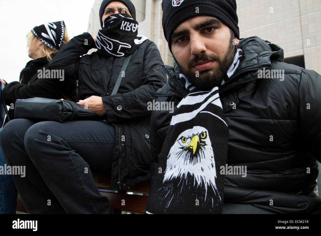 Caglayan, Istanbul, Turkey, 16th Dec, 2014. Fans of Besiktas soccer club, commonly called Carsi (marketplace), cheer in front of Caglayan courthouse in Istanbul as 35 members of the fanclub is on trial on allegations of a coup d'etat attempt during Gezi Park protests in Summer of 2013. Credit:  Bikem Ekberzade/Alamy Live News Stock Photo