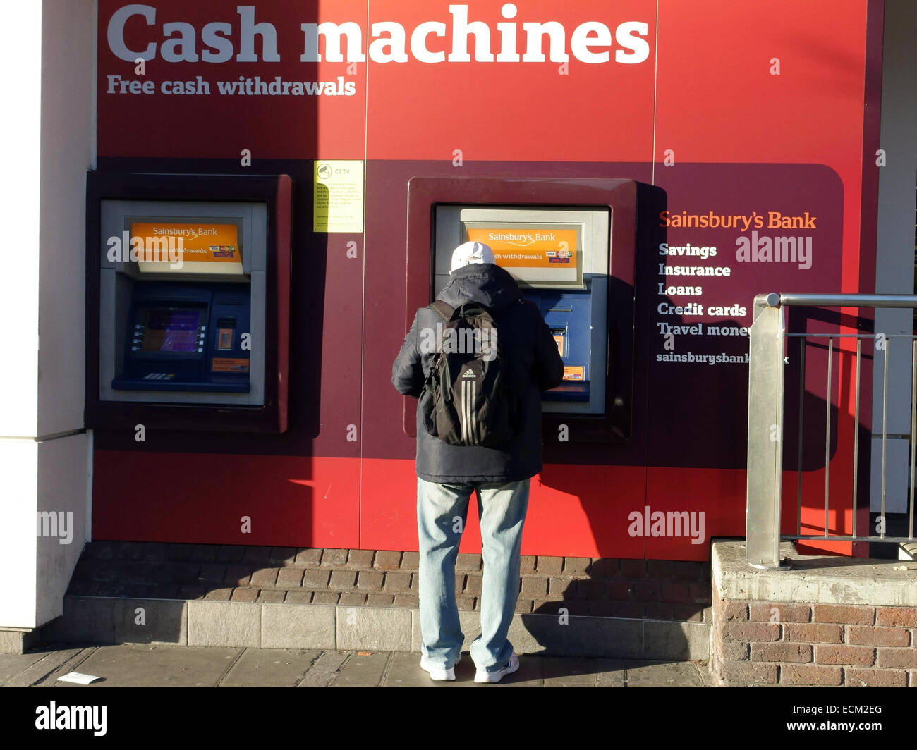 Cash machines outside branch of Sainsbury's, London Stock Photo