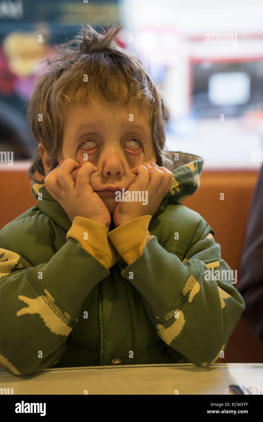 Four year old boy makes a scary face. Stock Photo