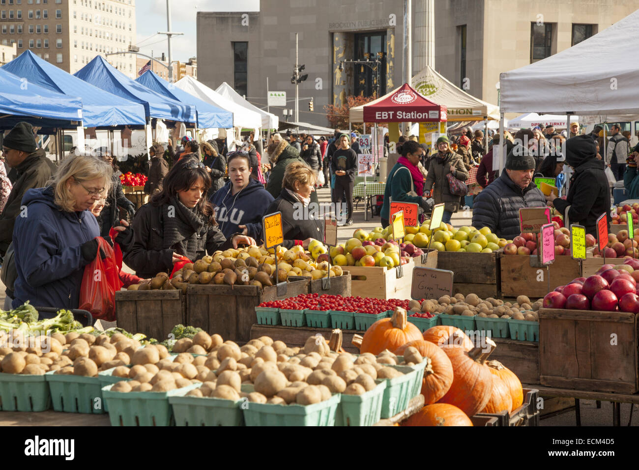 People shop in the late autumn at the Grand Army Plaza farmers market