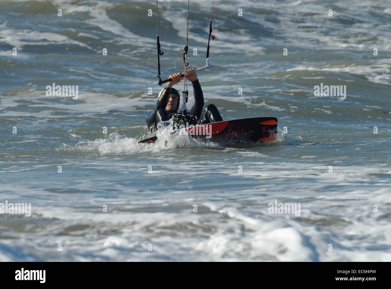 Kiteboarding in strong winds a big seas at Porth Neigwl, North Wales