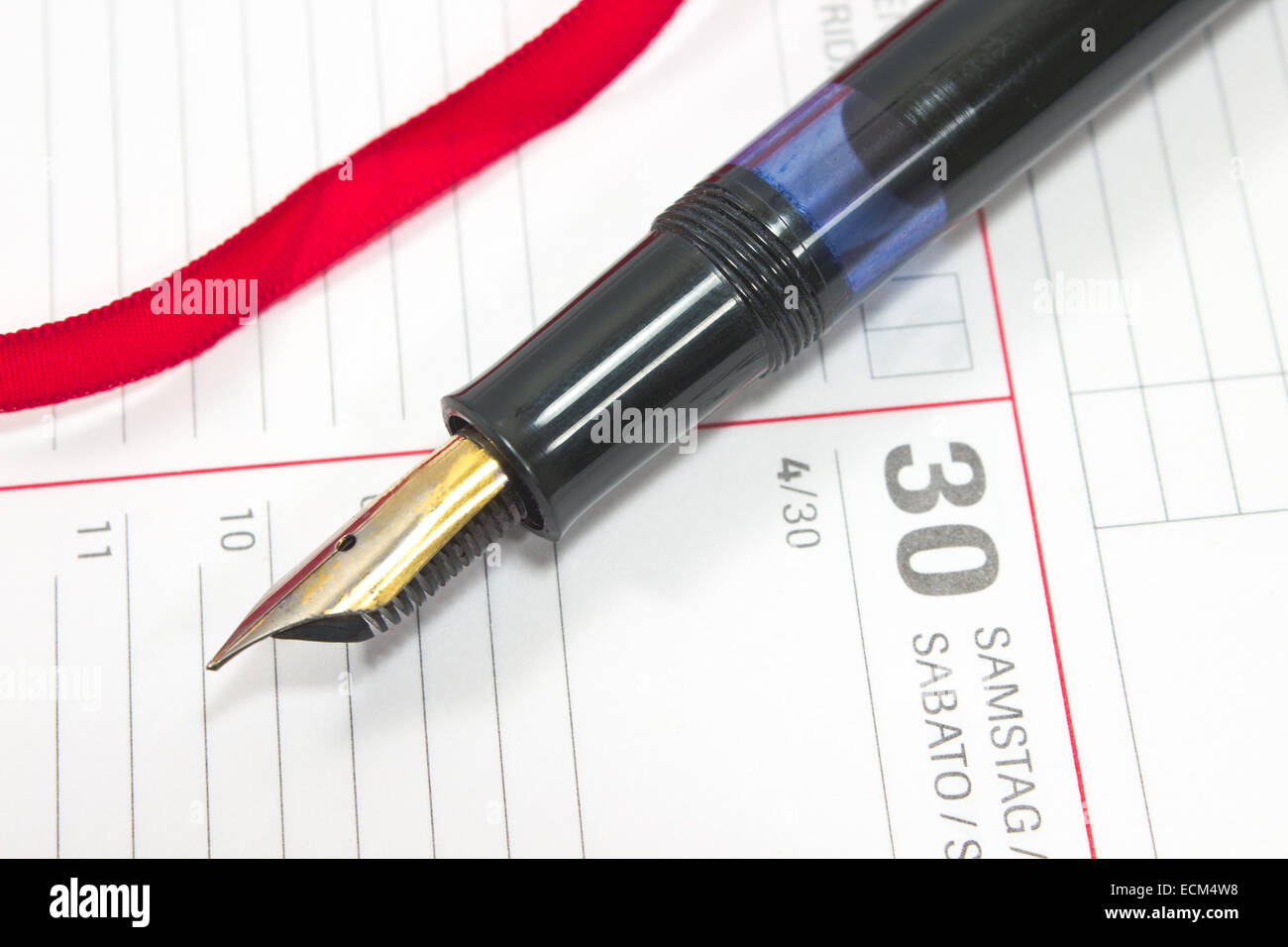 Fountain pen on personal organizer Stock Photo - Alamy