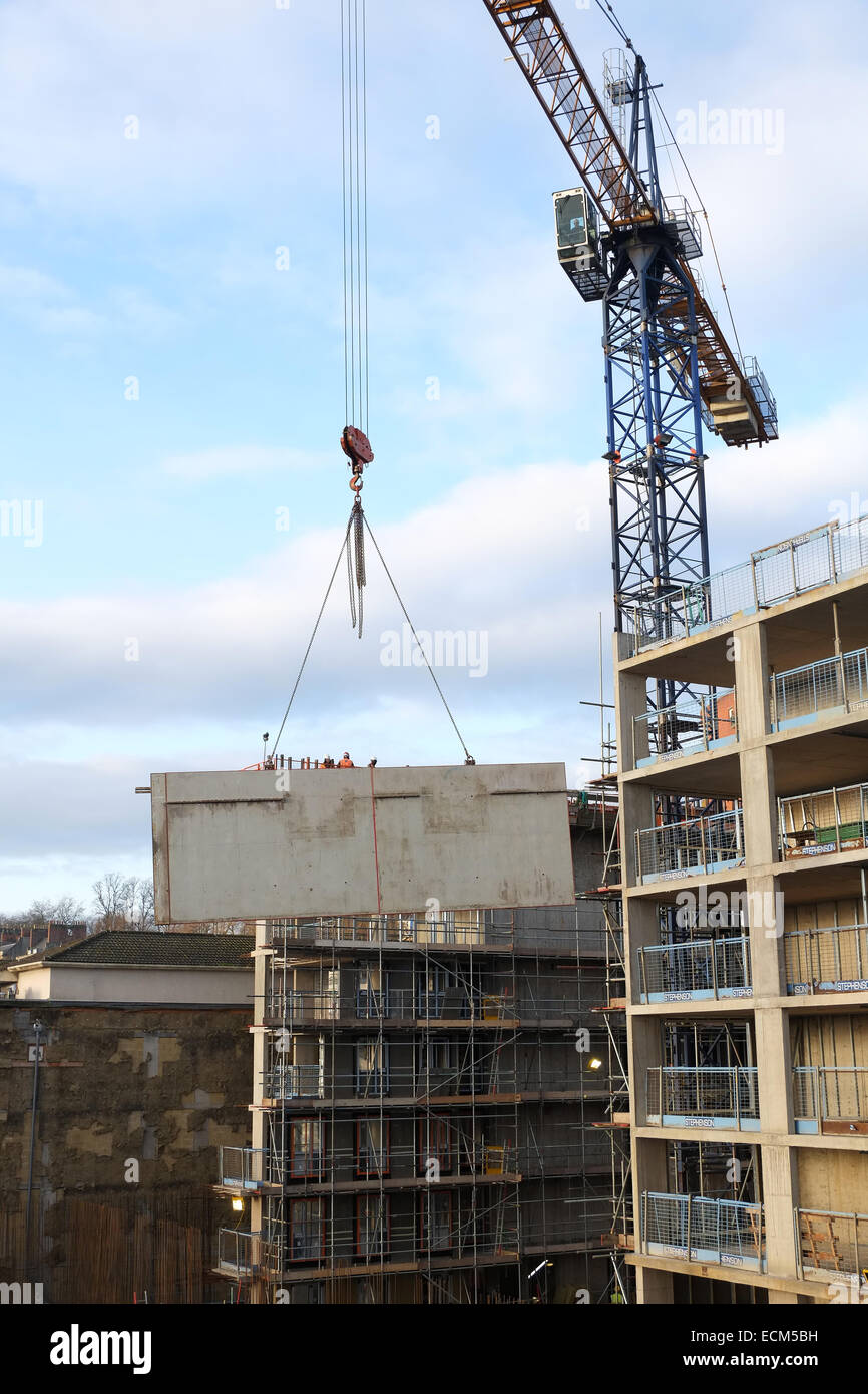 Construction crane lifting large panel hi-res stock photography and ...