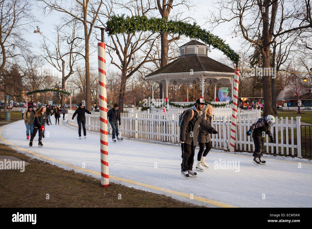 People ice skating in Gage Park in downtown Brampton, Ontario Stock