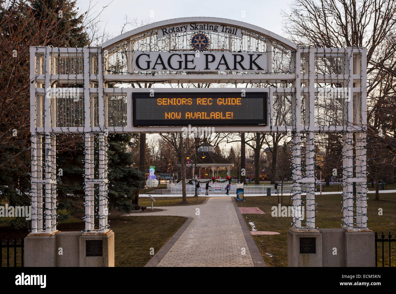 The main entrance to Gage Park with a sign covered in Christmas Lights