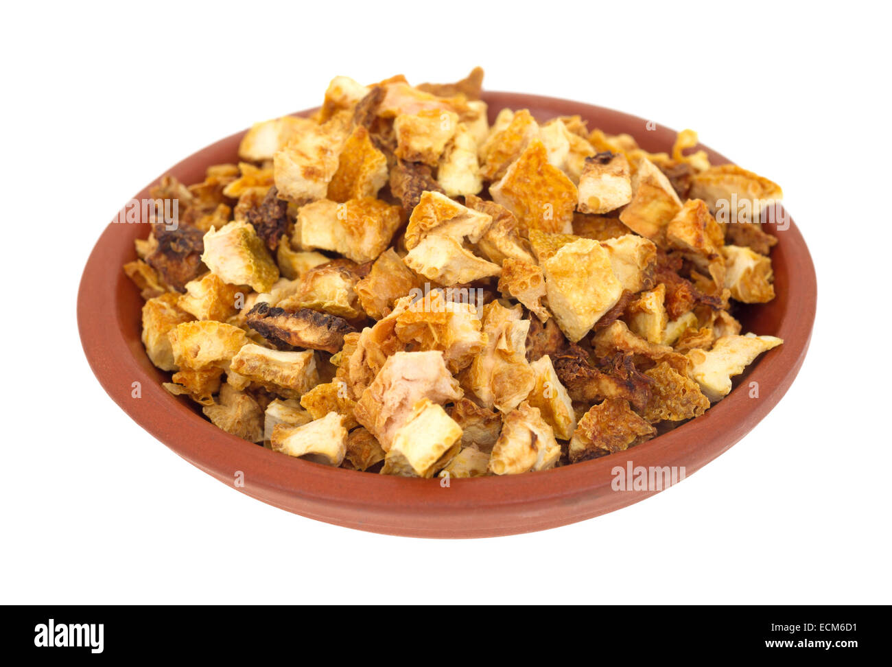 A small bowl filled with chopped orange peel rind on a white background. Stock Photo