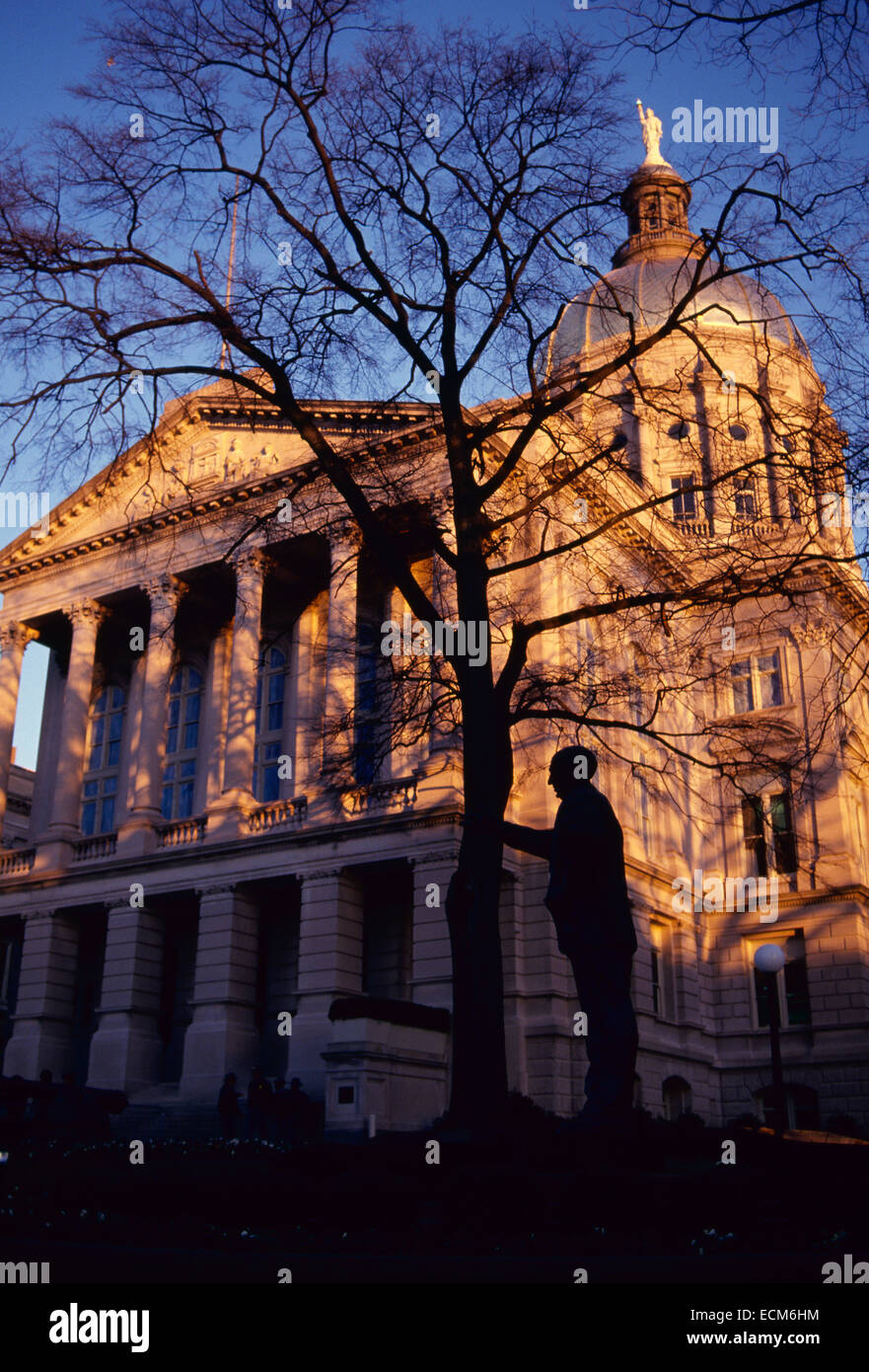The Georgia state capitol in late afternoon winter light. A statue honoring Senator Richard Russell stands in front. Stock Photo