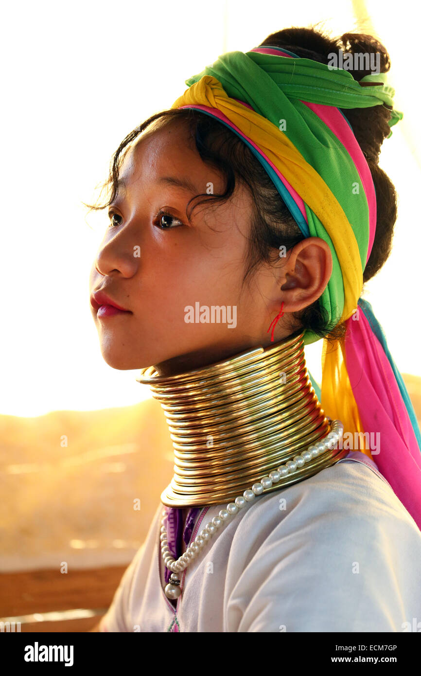 Giraffe women wearing brass rings on their necks in the Long Necked Karen village in Chiang Rai province in Thailand Stock Photo