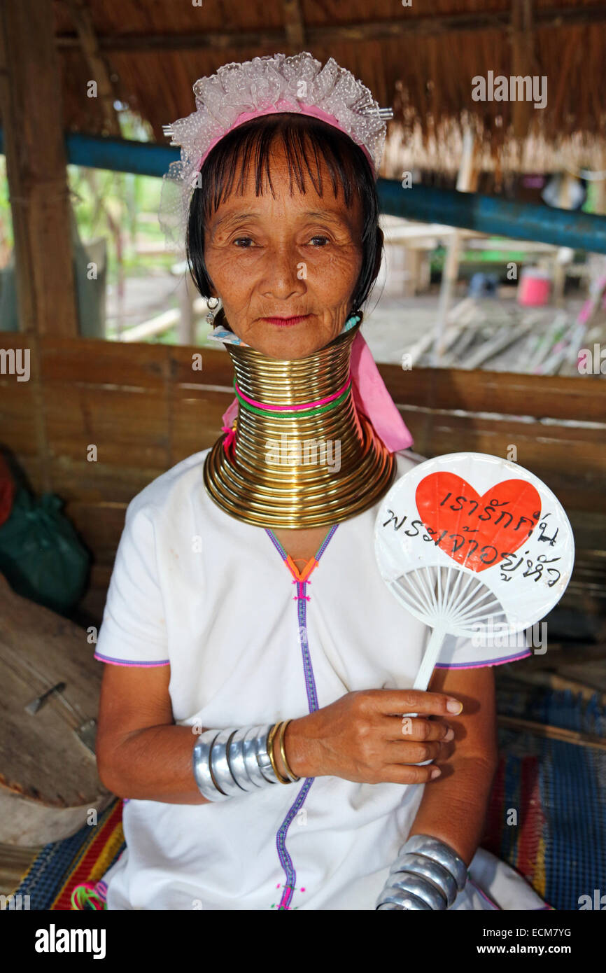 Giraffe women wearing brass rings on their necks in the Long Necked Karen village in Chiang Rai province in Thailand Stock Photo