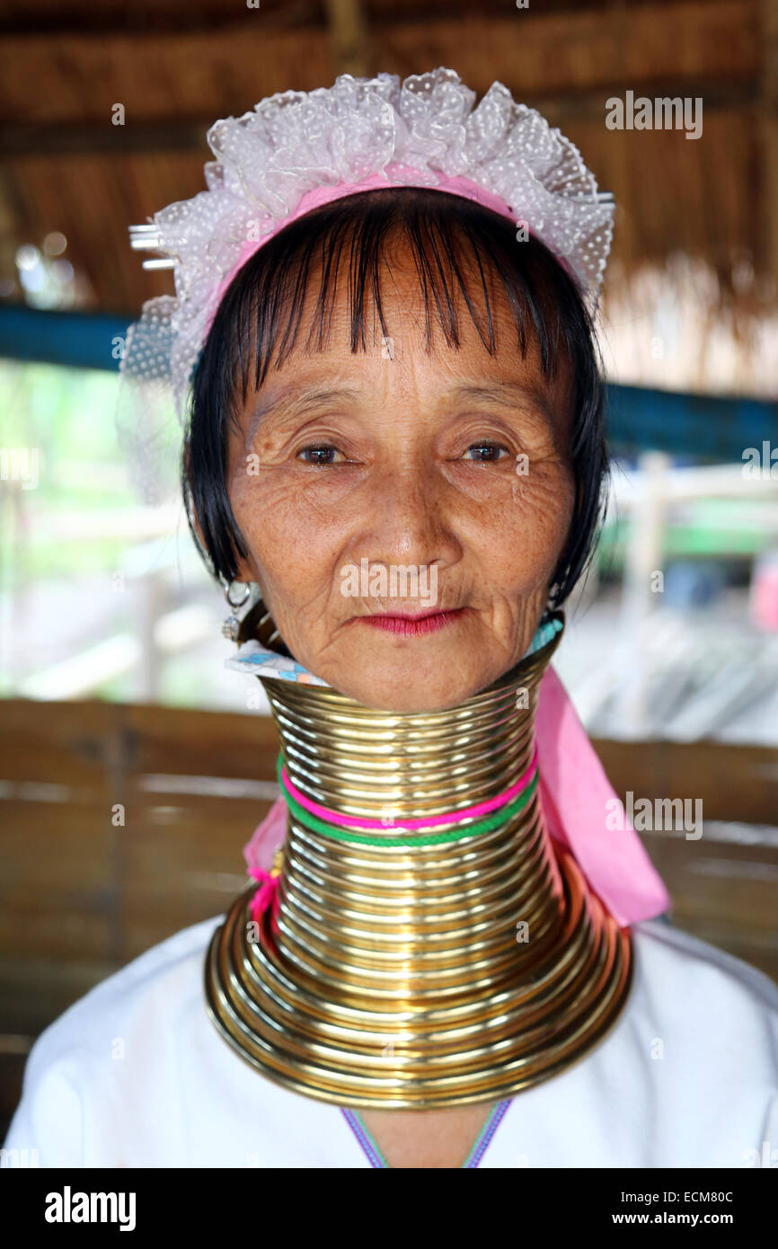 Giraffe women wearing brass rings on their necks in the Long Necked Karen village in Chiang Rai province in Thailand Stock Photo