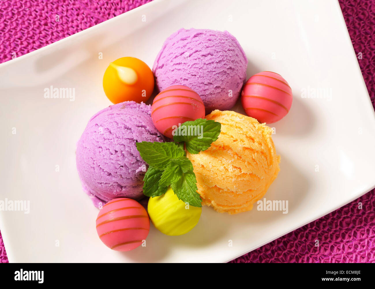 Fruit-flavored ice cream and white chocolate bonbons with fruit ganache