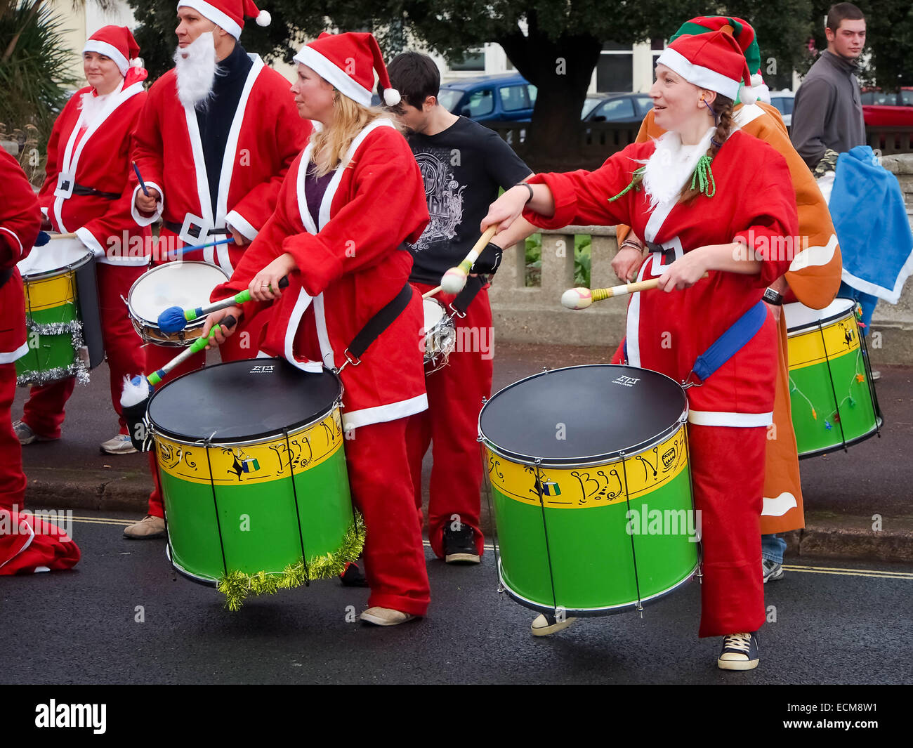 Batala Portsmouth Reggae and Samba band entertain runners taking part in the Portsmouth 2014 Santa Run Stock Photo