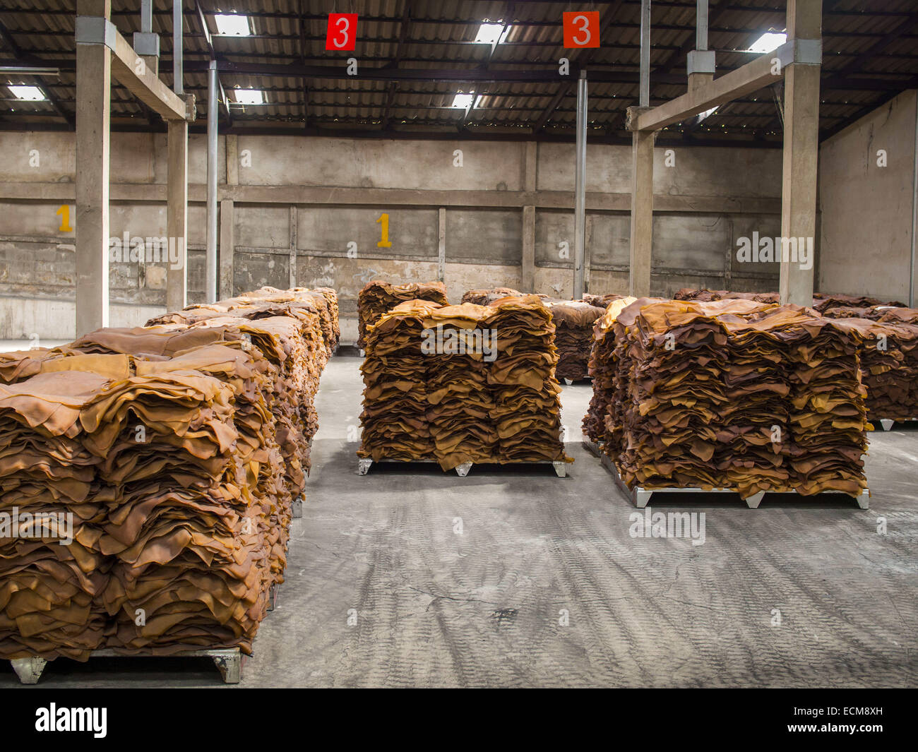 Chum Saeng, Rayong, Thailand. 16th Dec, 2014. Smoked rubber sheets in a