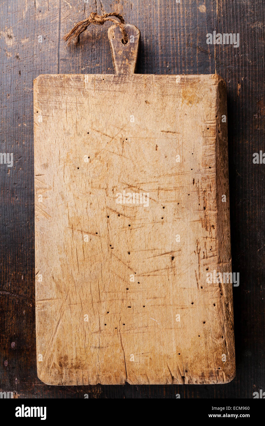 Chopping cutting board on dark wooden background Stock Photo