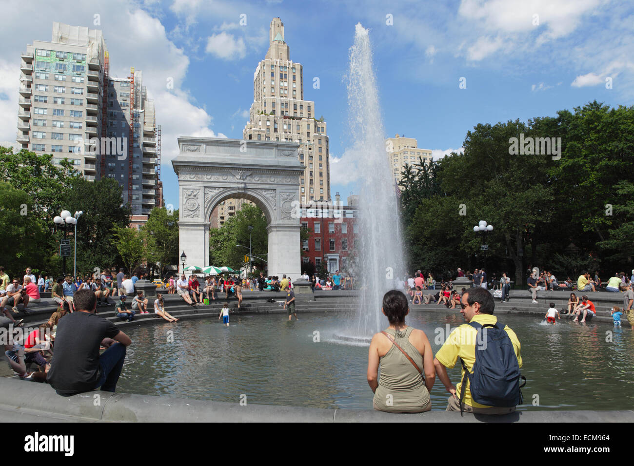 Summer view of Washington Square Park fountain with tourists and students Stock Photo