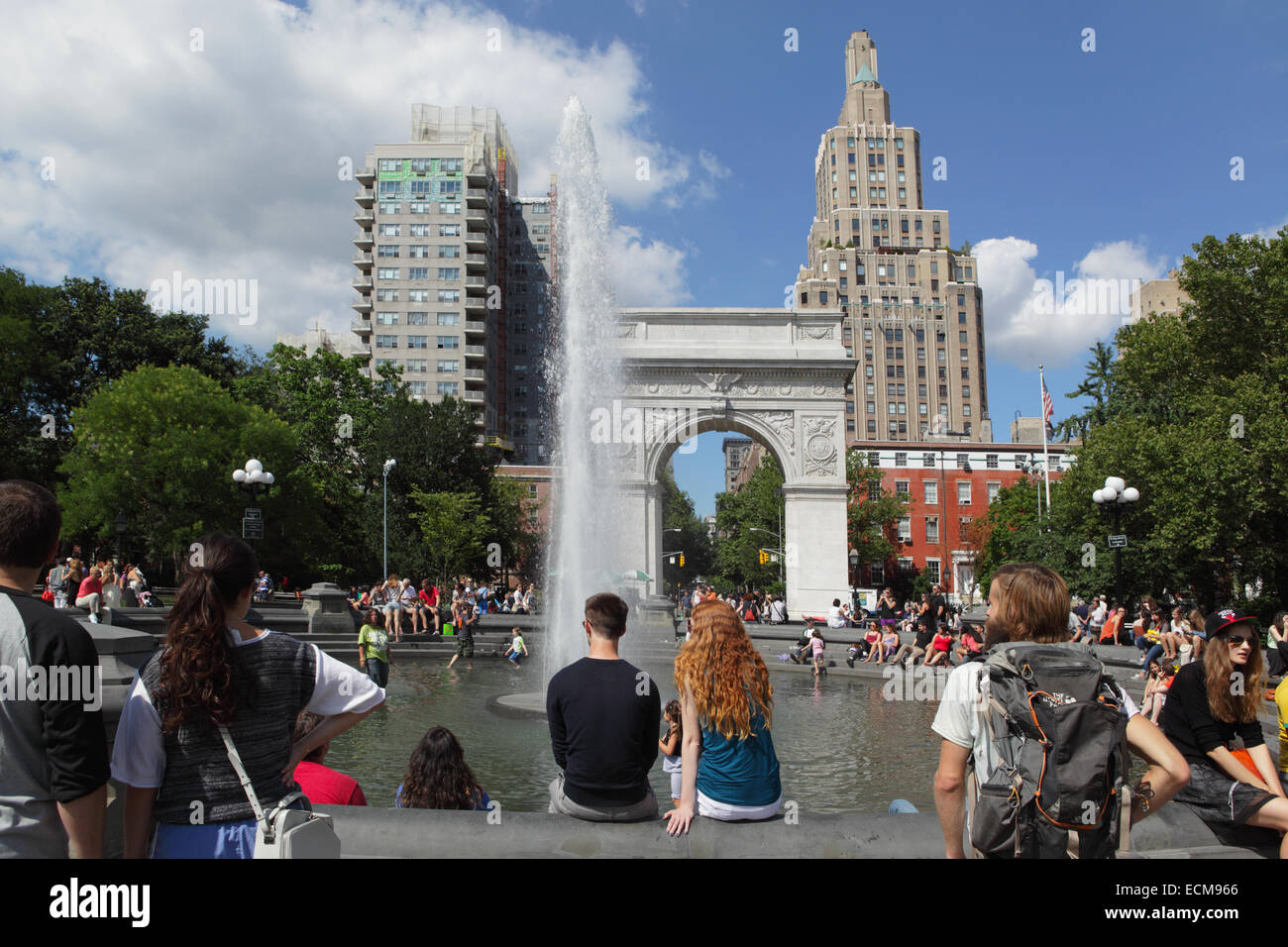 Summer view of Washington Square Park fountain with tourists and students Stock Photo