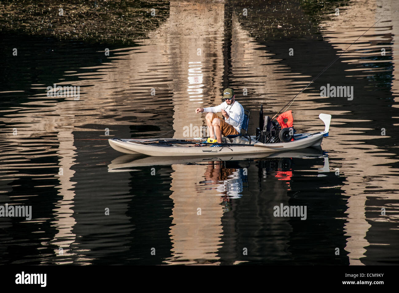 A kayak angler prepares to start fishing on Lady Bird Lake in downtown