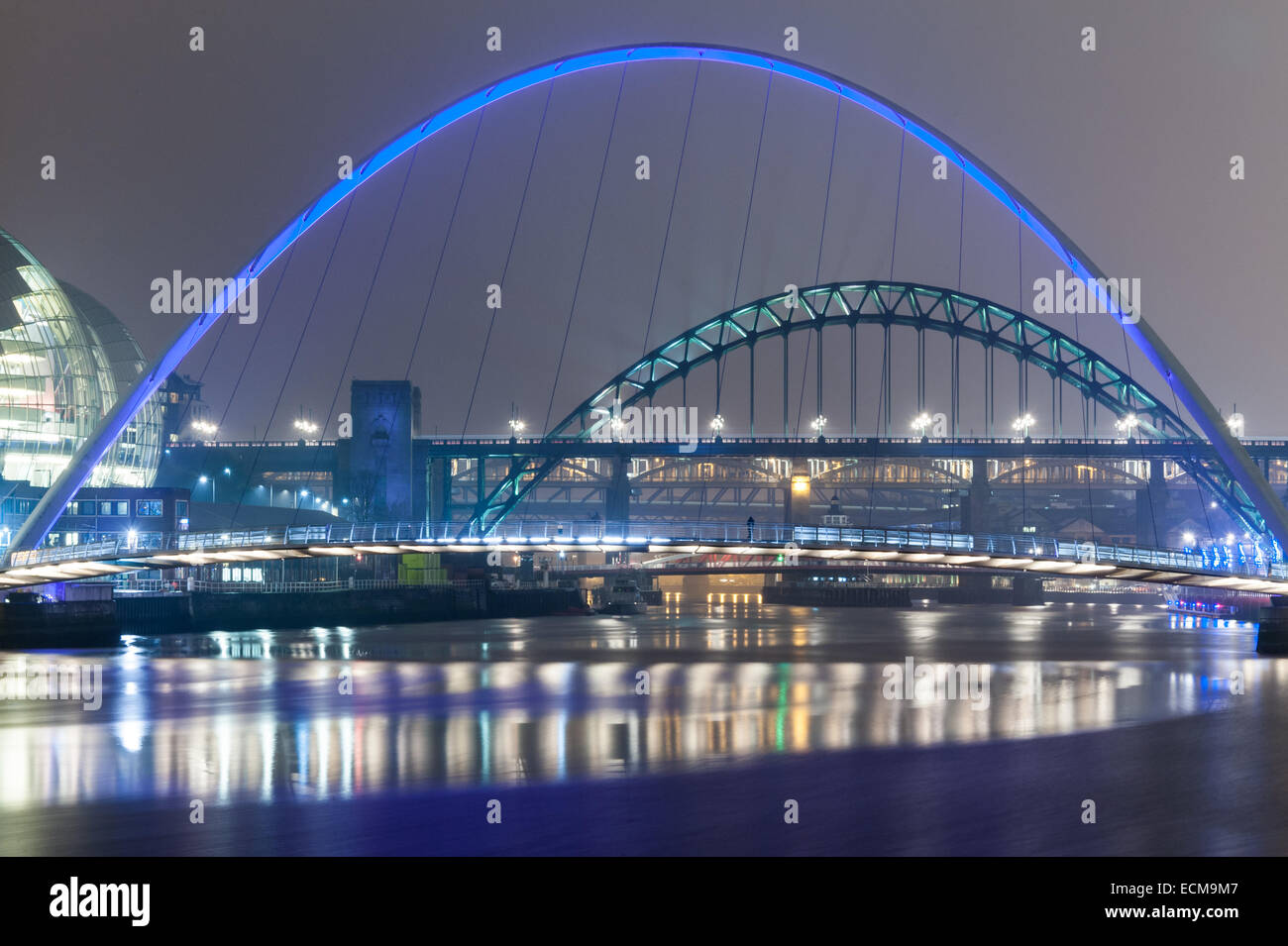 The bridges over the River Tyne in Newcastle-upon-Tyne, England seen at night. Stock Photo