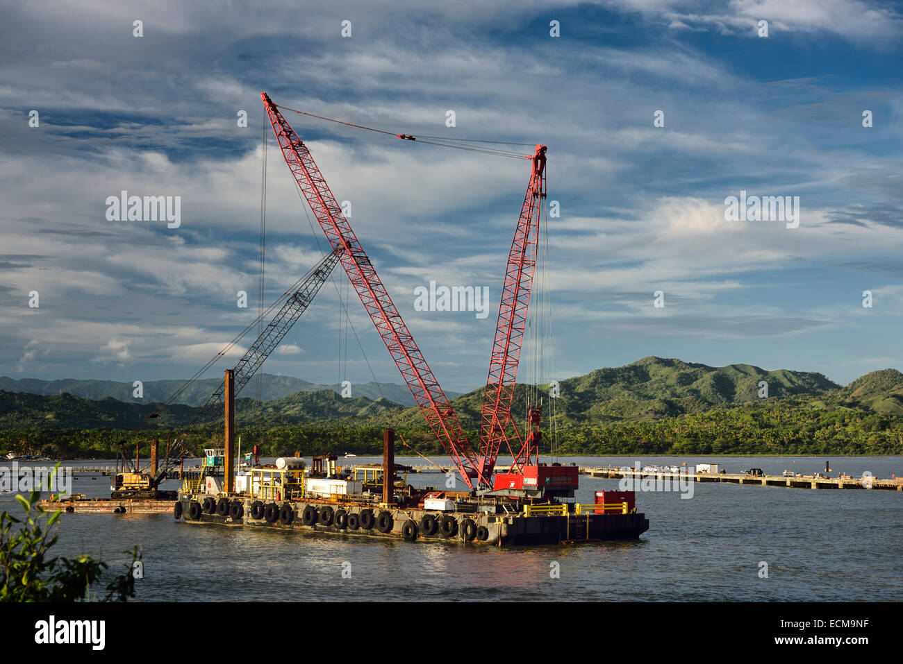 Crane barge constructing new cruise ship terminal in Maimon Bay near Puerto Plata Dominican Republic Stock Photo