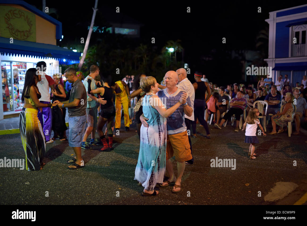 Couples dancing to merengue music at a Resort outdoor street party Puerto  Plata Dominican Republic Stock Photo