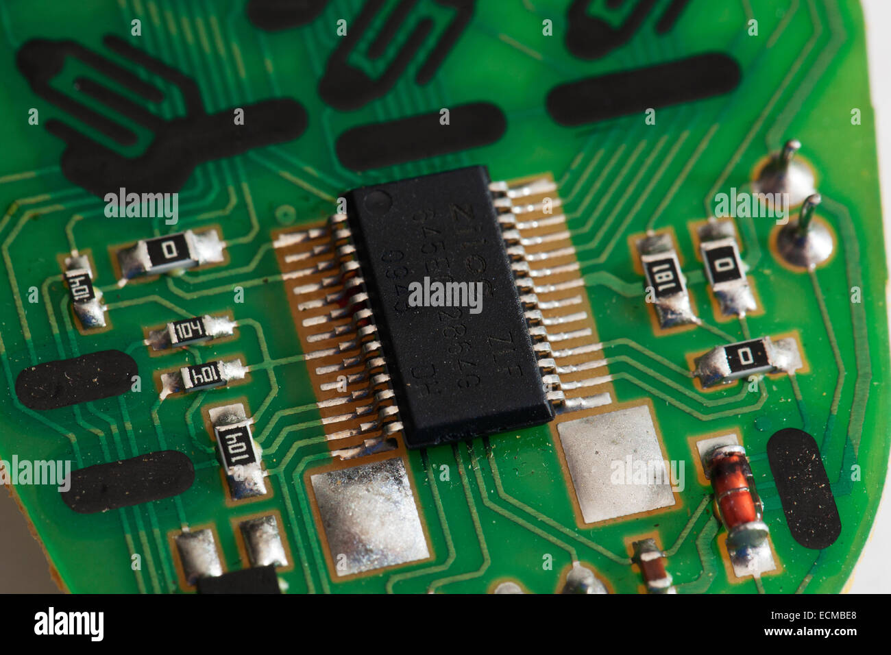 Microchip Connections of a Remote on a green PBC circuit board Stock Photo